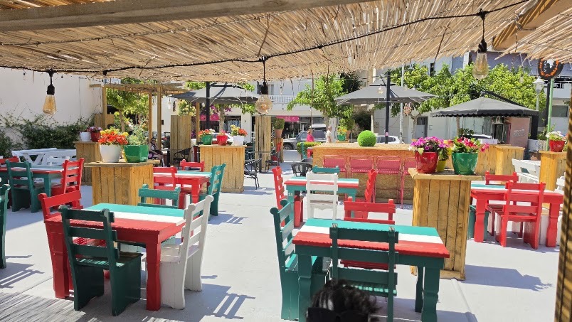 Colourful terrace tables under the bamboo roof
